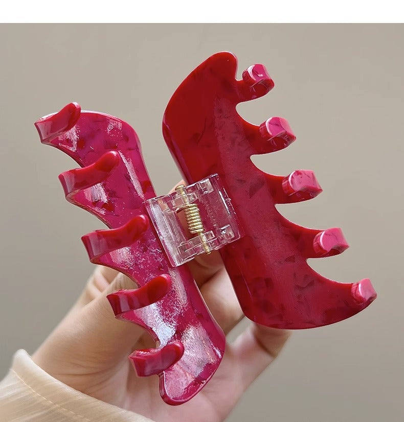 White Dragon Fruit Colored Hair Clip With A Spoon On The Back Of The Head